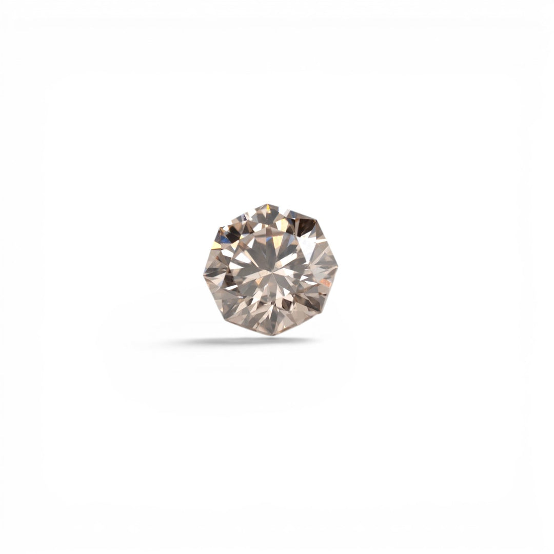 Stórica Studio custom engagement rings Seattle, 1.03ct octagon brilliant-cut lab-grown diamond in champagne C4, VS2 clarity, with warm blush-sand tones, photographed loose on a light gray background.