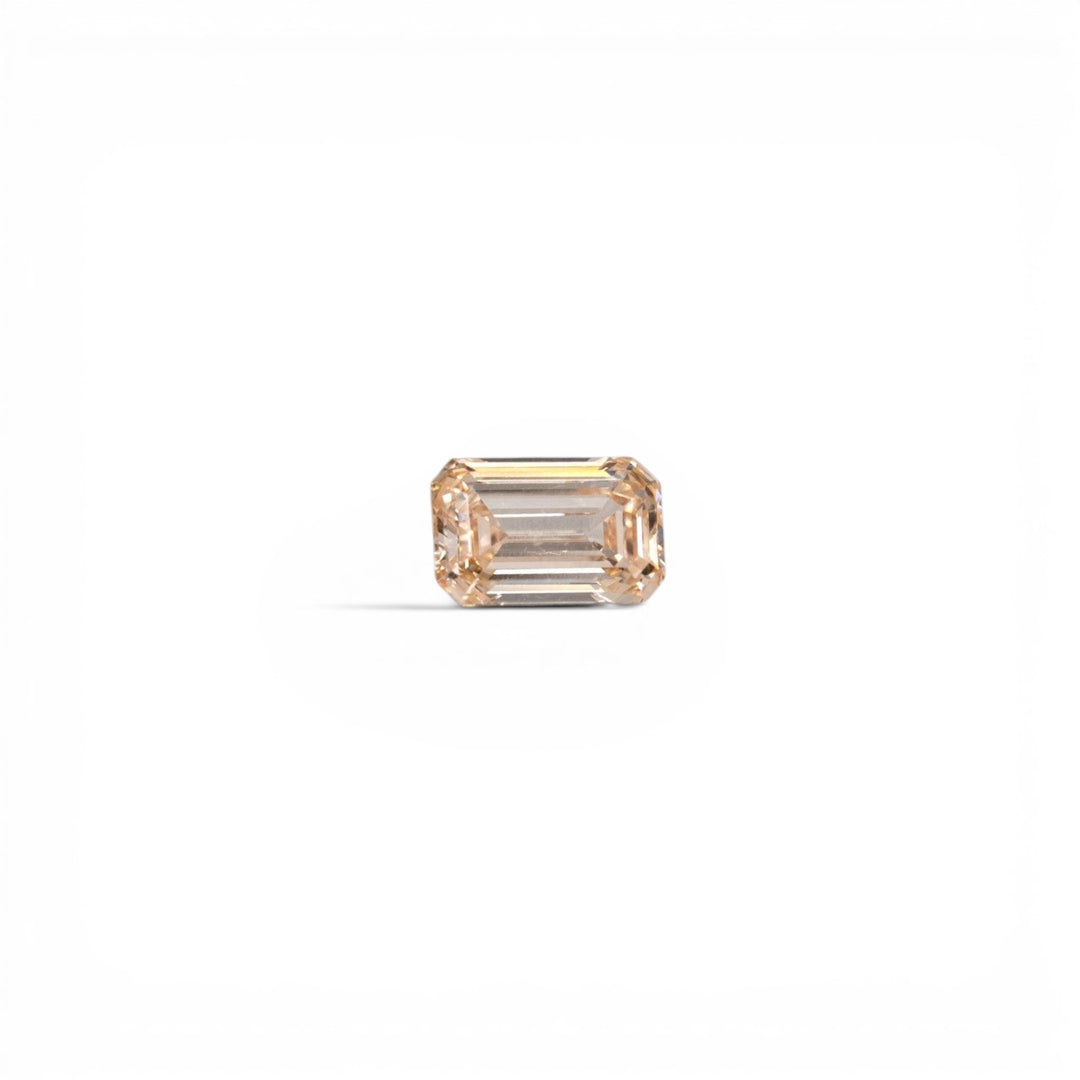 1.05ct lab-grown champagne emerald cut diamond, C2 color, VS1 clarity, with soft peachy-warm tone, by Stórica Studio - custom engagement rings in Seattle.