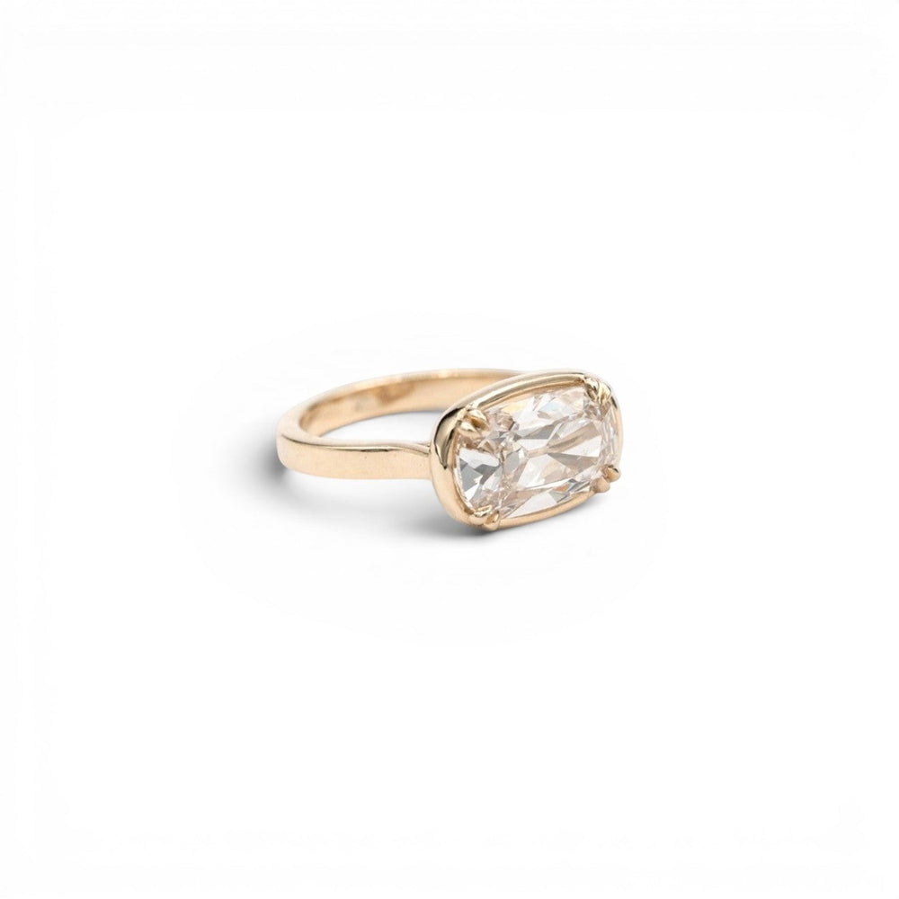 3.5ct lab-grown champagne antique-inspired cushion diamond in a double-prong faux bezel setting in 14k yellow gold, by Stórica Studio - custom engagement rings in Seattle.