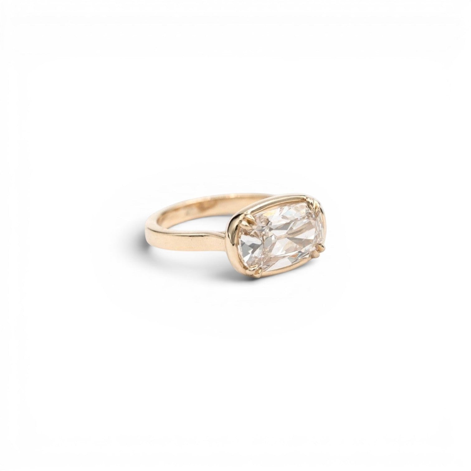 3.5ct lab-grown champagne antique-inspired cushion diamond in a double-prong faux bezel setting in 14k yellow gold, by Stórica Studio - custom engagement rings in Seattle.