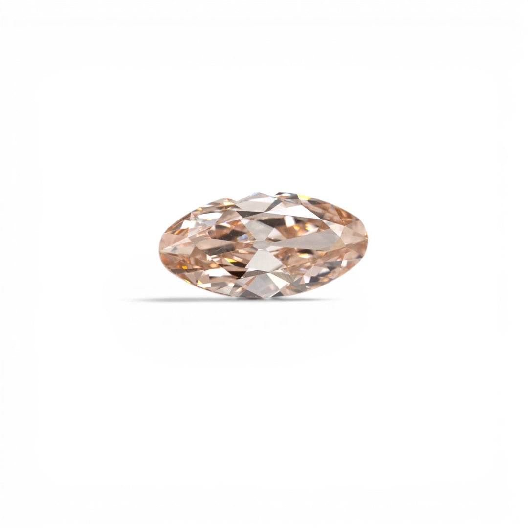 Stórica Studio custom engagement rings Seattle, 1.78ct moval lab-grown diamond in champagne C3, VS1 clarity, with soft peachy-warm tones, photographed loose on a light gray background.