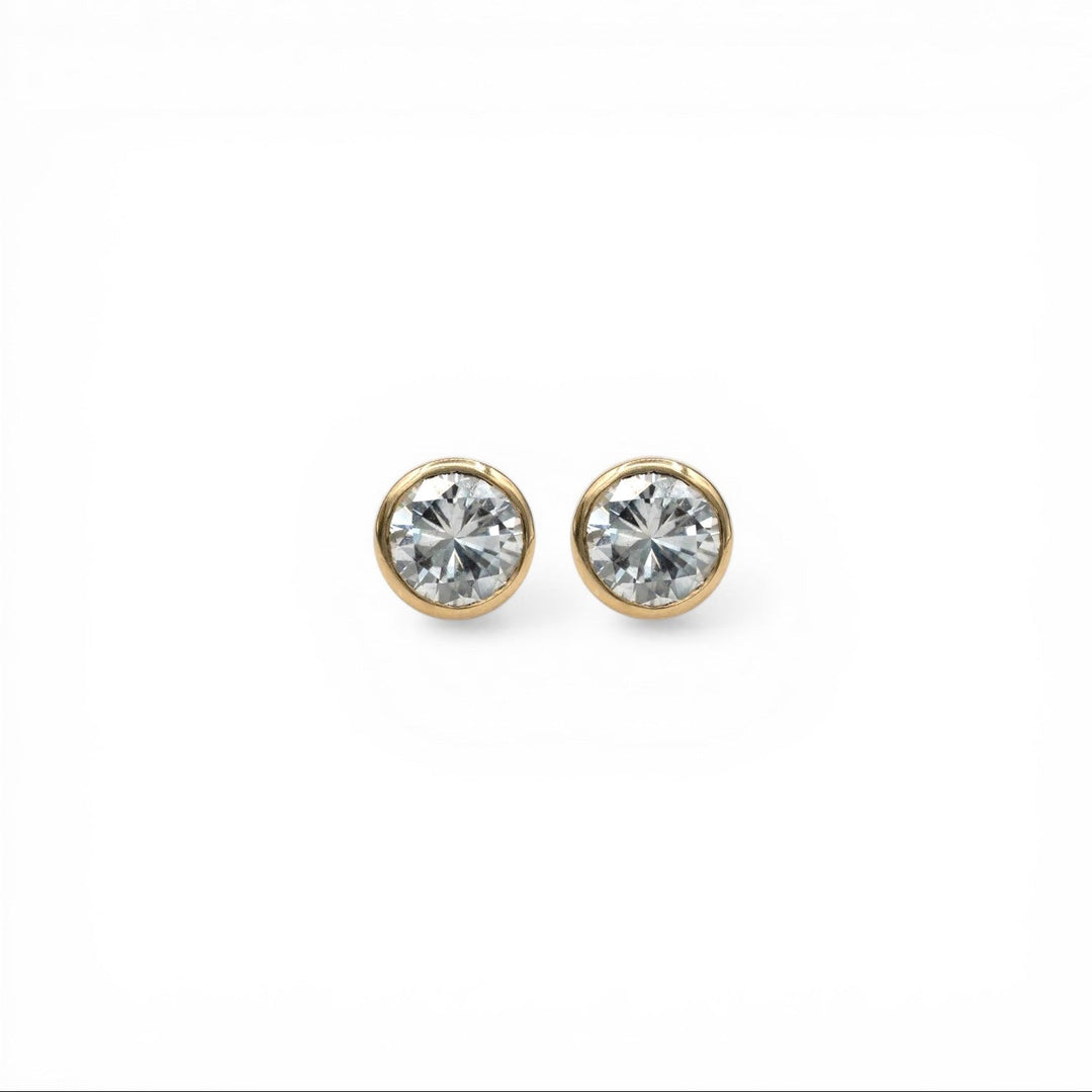 14k yellow gold Northstar diamond stud earrings with 1.40 carat total weight bezel set martini diamonds G SI recycled