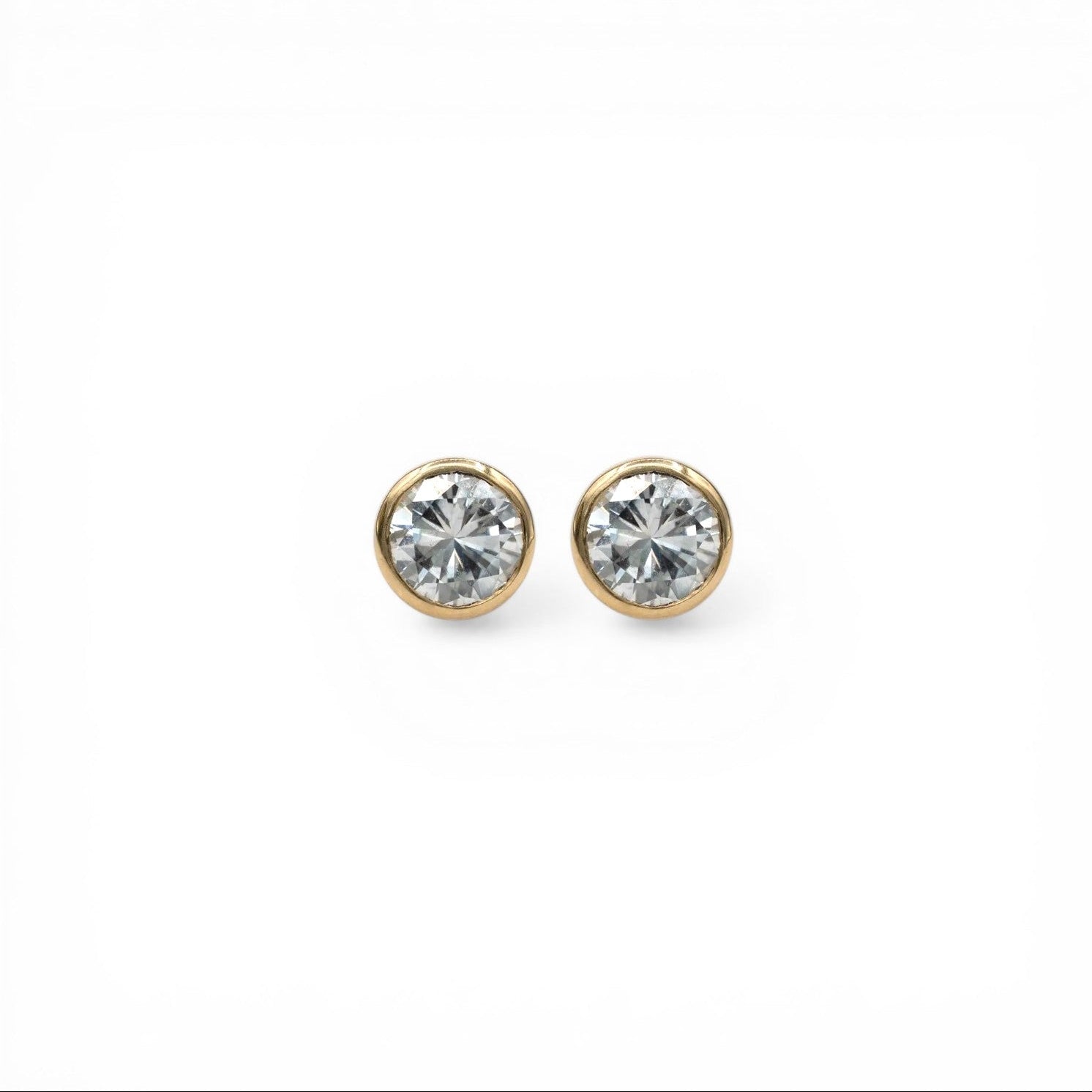 14k yellow gold Northstar diamond stud earrings with 1.40 carat total weight bezel set martini diamonds G SI recycled