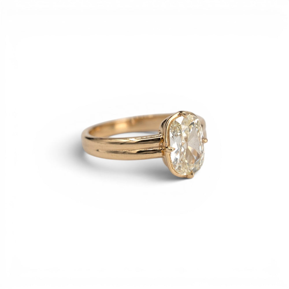 1.53ct earth-mined antique elongated cushion diamond in light yellow M color with compass prong setting in 14k yellow gold, by Stórica Studio - custom engagement rings in Seattle.