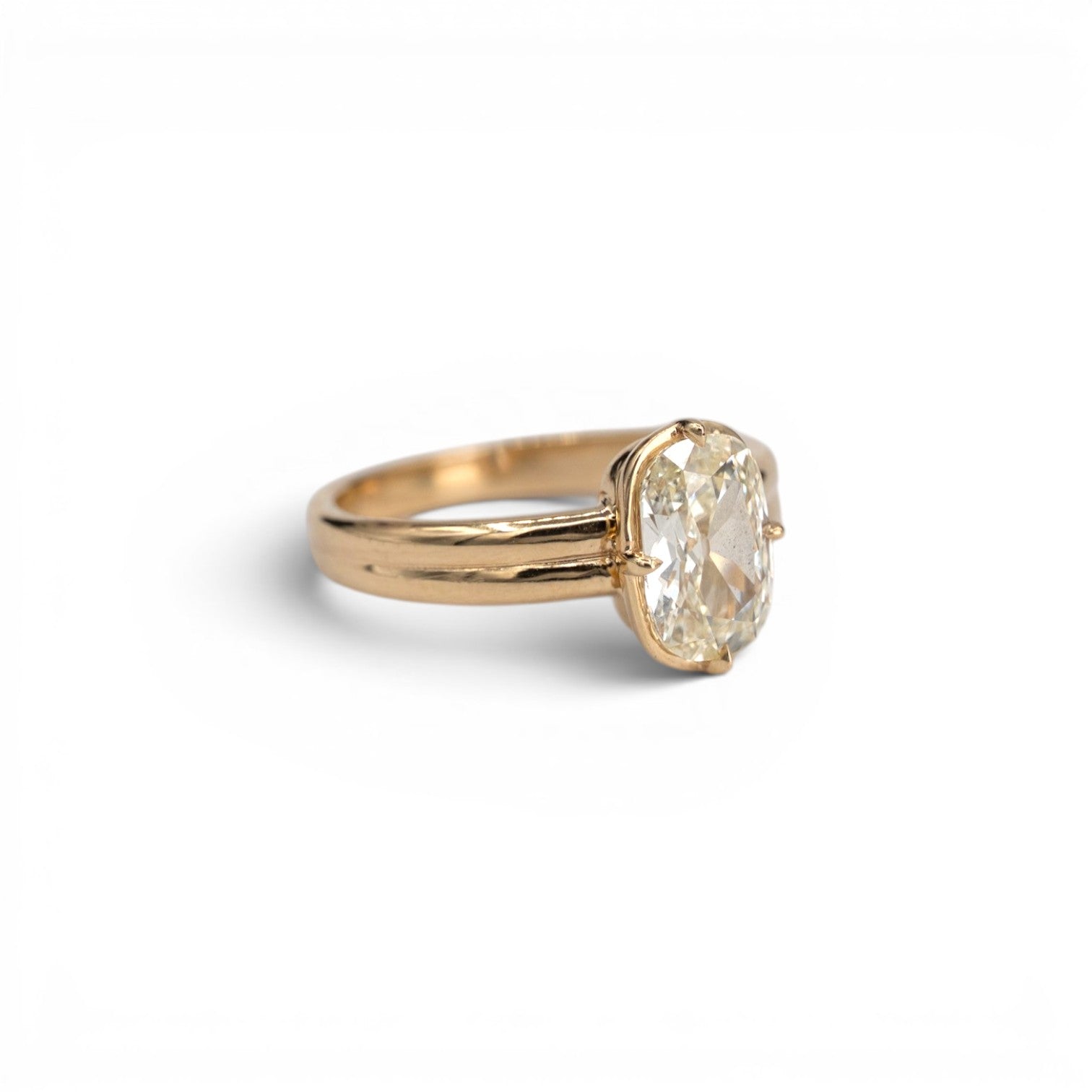 1.53ct earth-mined antique elongated cushion diamond in light yellow M color with compass prong setting in 14k yellow gold, by Stórica Studio - custom engagement rings in Seattle.