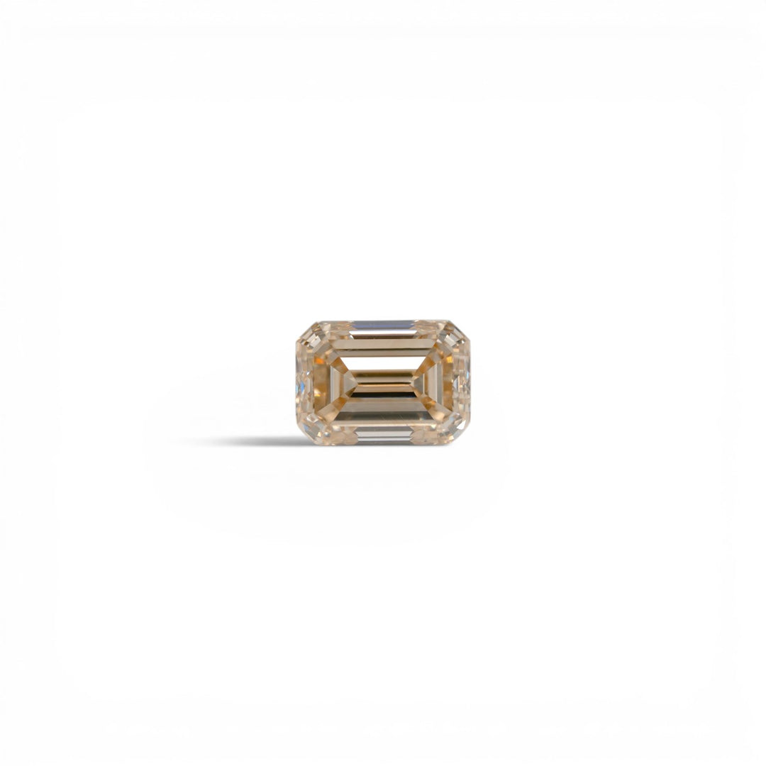 Stórica Studio 1.11ct emerald cut champagne diamond, C4 color, VS1 clarity, with elegant step faceting.