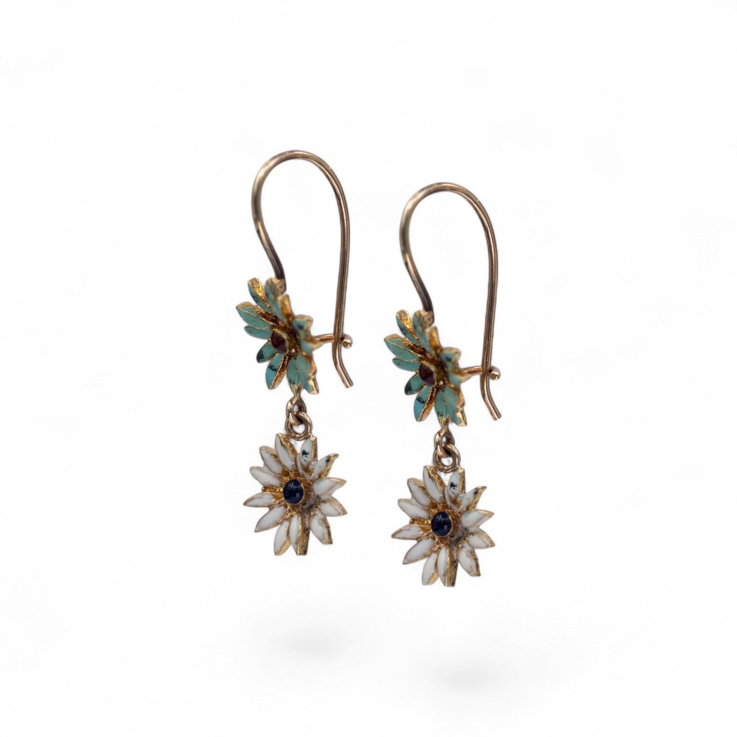 Stórica Studio 18k yellow gold enamel flower drop earrings with white petals and blue center gems.
