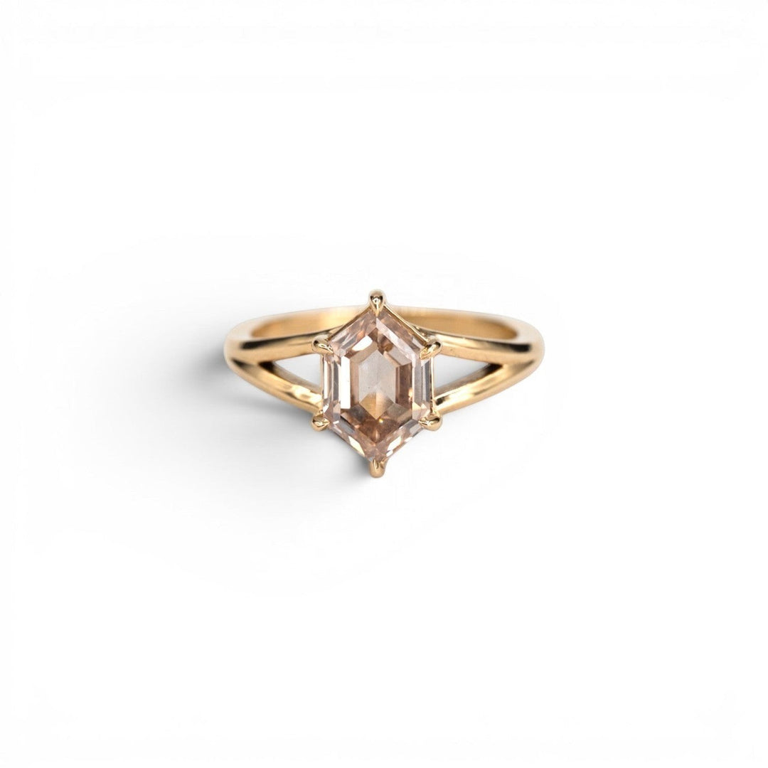 Stórica Studio custom engagement rings Seattle, the Juniper ring featuring a 2.10ct lab-grown champagne hexagon diamond in a 14k yellow gold split shank setting, photographed on a white background.