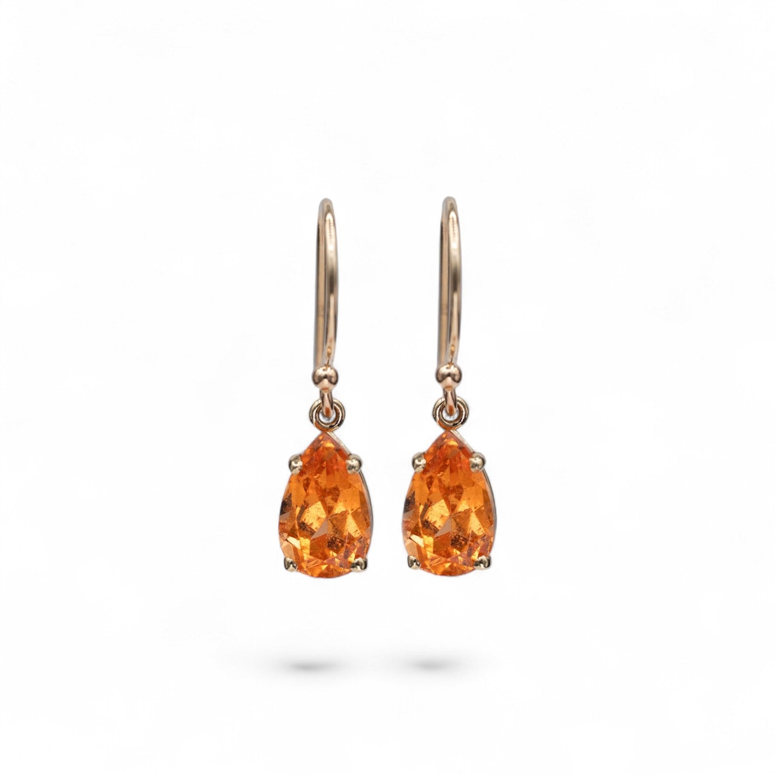 ]14k yellow gold French hook earrings with pear-shaped 2 carat total spessartite garnet drops in warm sunset orange