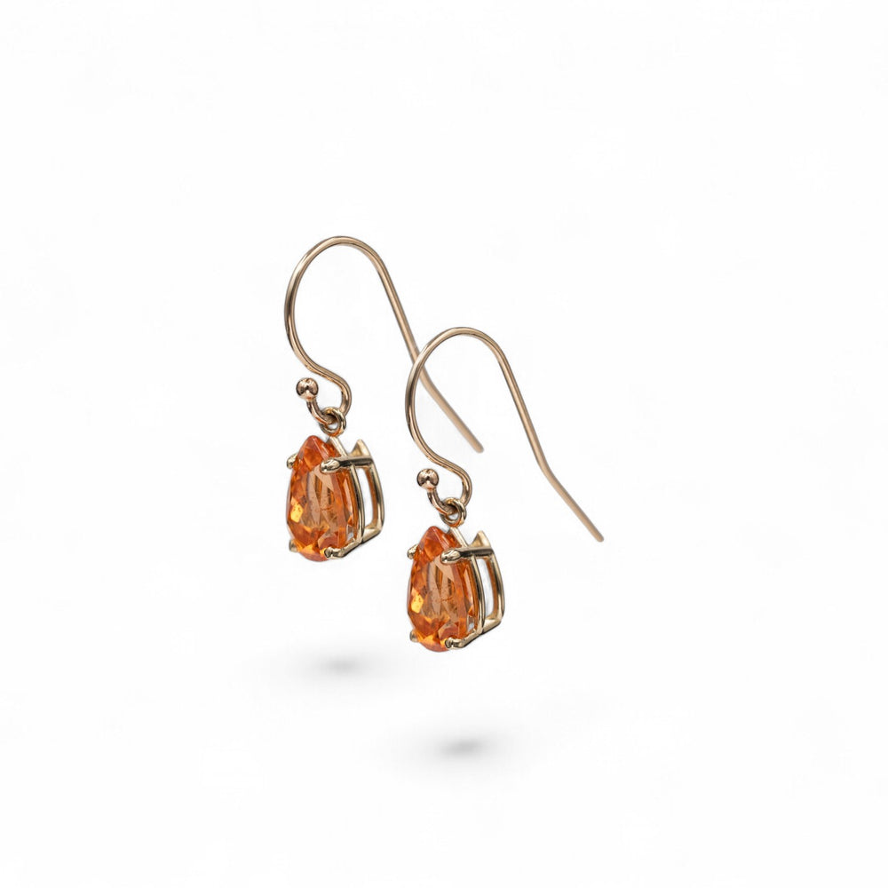 Stórica Studio 14k yellow gold drop earrings featuring pear-cut Spessartite Garnets, 2ct total weight.
